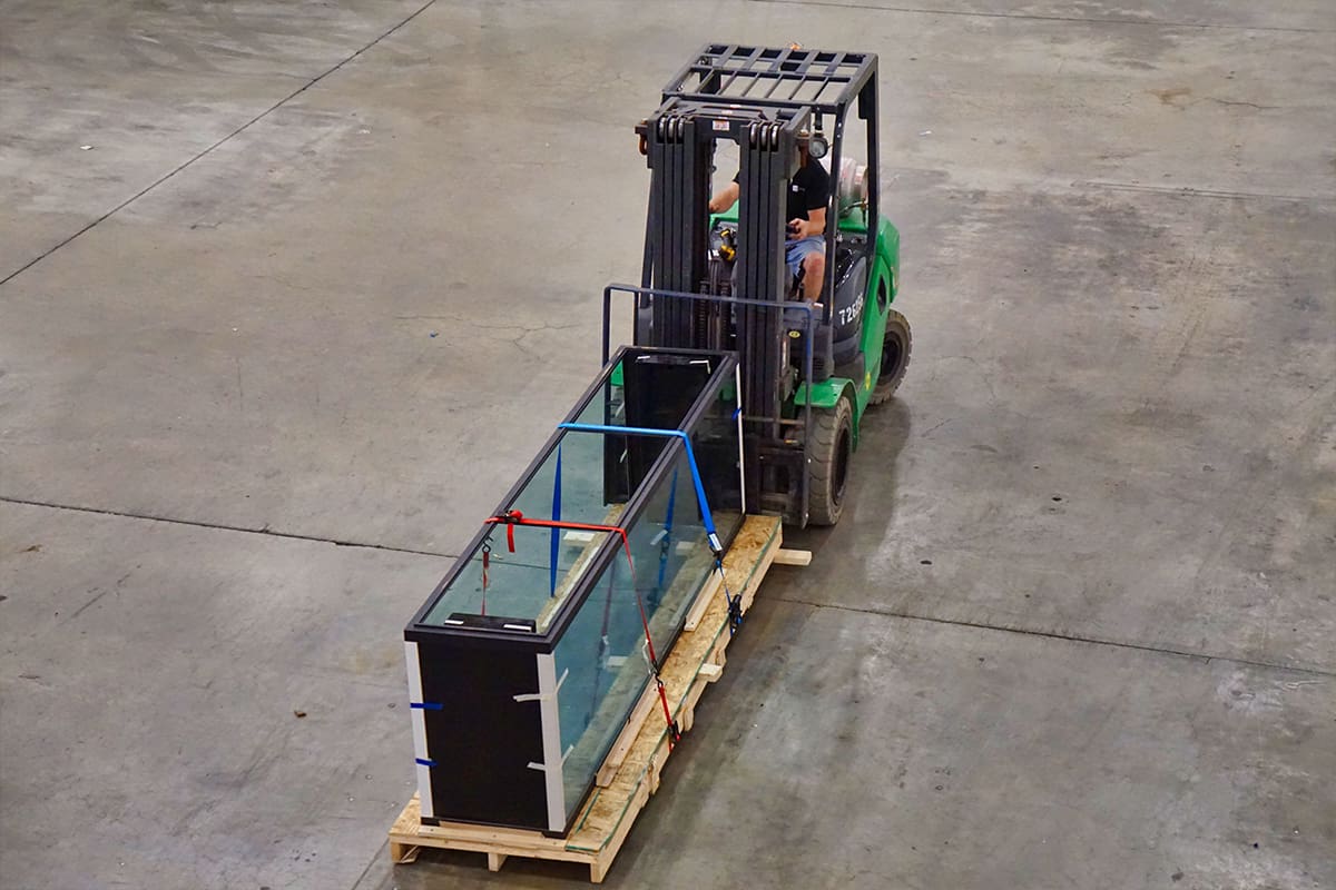 Moving an Aquarium An Aqua Creations worker moving a custom aquarium