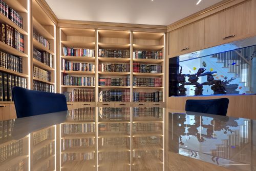 Built-in custom saltwater aquarium installed in a home office study in Toms River, New Jersey by Aqua Creations